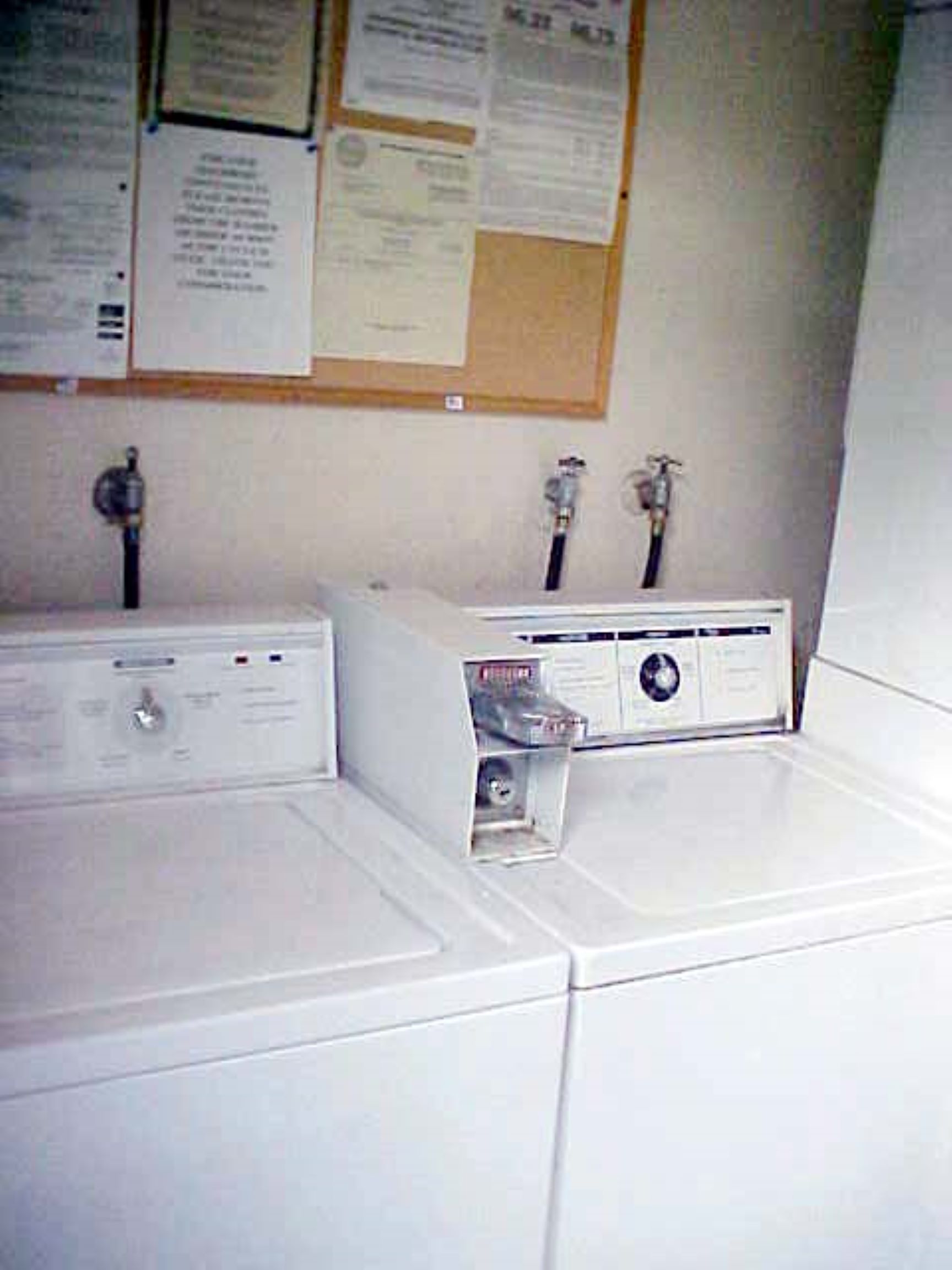 A white washer and dryer in a room.