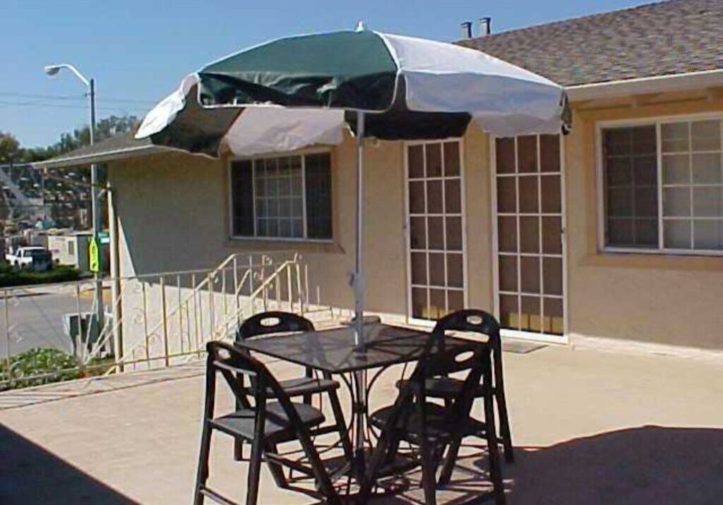 A patio table and chairs with an umbrella.